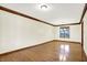 Formal dining room with hardwood floors, decorative trim, and a chandelier at 8619 Wrangler Ct, Indianapolis, IN 46217