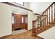 Spacious front foyer with hardwood floors and stairs leading to the upper level at 8619 Wrangler Ct, Indianapolis, IN 46217