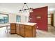 The kitchen island with seating is centrally located with great room access at 8619 Wrangler Ct, Indianapolis, IN 46217