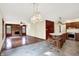 Open concept featuring the kitchen with island seating, next to a comfortable living room and fireplace at 8619 Wrangler Ct, Indianapolis, IN 46217
