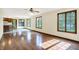 Open layout with hardwood floors seamlessly connecting the living area to the kitchen at 8619 Wrangler Ct, Indianapolis, IN 46217