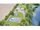 Drone shot showcasing the home, pool, outbuildings, and large parking area at 8879 W County Road 700 S, Coatesville, IN 46121