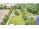 Aerial image featuring a shed, green lawn, and mature trees at 8879 W County Road 700 S, Coatesville, IN 46121