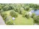 Aerial view of the shed, mature trees, and landscaped yard at 8879 W County Road 700 S, Coatesville, IN 46121