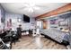 Bedroom with hardwood flooring, a ceiling fan, and ample workspace at 8879 W County Road 700 S, Coatesville, IN 46121