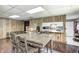 Bright dining area with wood-style flooring, adjacent kitchen, and room for large table at 8879 W County Road 700 S, Coatesville, IN 46121
