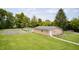 Expansive backyard featuring an in-ground pool, basketball court and charming single-story home at 8879 W County Road 700 S, Coatesville, IN 46121