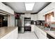 Well-equipped kitchen featuring stainless steel appliances, white cabinetry, and plenty of counter space at 8879 W County Road 700 S, Coatesville, IN 46121