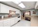 Functional kitchen with white cabinetry, neutral countertops, and ample storage space at 8879 W County Road 700 S, Coatesville, IN 46121