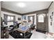 Living room with hardwood flooring, gaming chair, and natural light from two windows at 8879 W County Road 700 S, Coatesville, IN 46121