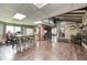 Cozy open-concept living space with fireplace, dining area, and laminate flooring at 8879 W County Road 700 S, Coatesville, IN 46121