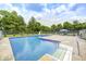 Outdoor pool with concrete surround, slide, and seating area, perfect for summer relaxation at 8879 W County Road 700 S, Coatesville, IN 46121