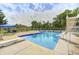 Outdoor swimming pool with diving board and slide, surrounded by a spacious concrete deck at 8879 W County Road 700 S, Coatesville, IN 46121