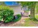 Cozy backyard featuring a small patio, mature trees, and well-maintained lawn at 9054 Cornucopia Dr, Indianapolis, IN 46268