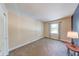 Bright bedroom features neutral walls and carpeting, complemented by natural light from a window at 9054 Cornucopia Dr, Indianapolis, IN 46268
