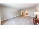 Spacious bedroom featuring neutral walls, and views of a walk-in closet and bathroom at 9054 Cornucopia Dr, Indianapolis, IN 46268