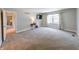 Large bedroom featuring neutral walls, carpeting, and a window letting in natural light at 9054 Cornucopia Dr, Indianapolis, IN 46268