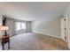 Large bedroom featuring neutral walls, carpeting, and a window letting in natural light at 9054 Cornucopia Dr, Indianapolis, IN 46268