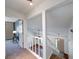 Bright entryway with stairs leading to the main living area and a view of the lower level at 9054 Cornucopia Dr, Indianapolis, IN 46268
