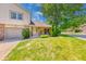 Charming home featuring a well-manicured lawn, brick accents, and a cozy front entrance at 9054 Cornucopia Dr, Indianapolis, IN 46268