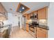 Kitchen features stainless steel appliances, granite countertops, and modern cabinets with a decorative ceiling accent at 9054 Cornucopia Dr, Indianapolis, IN 46268