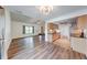 Open floor plan with stainless steel appliances, granite countertops and wood-look floors at 9054 Cornucopia Dr, Indianapolis, IN 46268