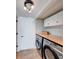 Cozy laundry room with modern appliances, butcher block countertop, and overhead lighting at 9054 Cornucopia Dr, Indianapolis, IN 46268