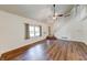 Bright living room featuring wood-look floors and vaulted ceilings at 9054 Cornucopia Dr, Indianapolis, IN 46268