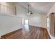 Spacious living area boasts wood-look flooring, vaulted ceilings, and natural light at 9054 Cornucopia Dr, Indianapolis, IN 46268