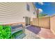 A cozy patio with a bench, privacy fence, and access to the home through a sliding glass door at 9054 Cornucopia Dr, Indianapolis, IN 46268