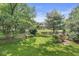 Well-maintained backyard with mature trees, lush greenery, and a serene atmosphere, creating a private outdoor oasis at 9221 Holyoke Ct, Indianapolis, IN 46268