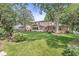 Spacious backyard with mature trees and greenery, providing a serene and private outdoor oasis for relaxation and enjoyment at 9221 Holyoke Ct, Indianapolis, IN 46268