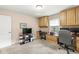 Comfortable bedroom featuring carpeted floors and built-in desk for a convenient workspace at 9221 Holyoke Ct, Indianapolis, IN 46268