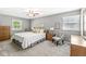 Cozy bedroom featuring neutral walls, ceiling fan, and carpeted floors for added comfort at 9221 Holyoke Ct, Indianapolis, IN 46268