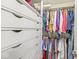 Walk-in closet featuring custom drawers and ample hanging storage for organization at 9221 Holyoke Ct, Indianapolis, IN 46268