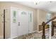 Bright entryway with decorative glass sidelights and tile flooring at 9221 Holyoke Ct, Indianapolis, IN 46268