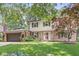 Charming two-story home with a well-manicured lawn and mature trees at 9221 Holyoke Ct, Indianapolis, IN 46268