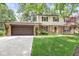 Traditional two-story brick and siding home with an attached two-car garage at 9221 Holyoke Ct, Indianapolis, IN 46268