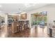 Open kitchen featuring a breakfast bar and a connecting sunroom at 9221 Holyoke Ct, Indianapolis, IN 46268