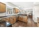 Well-equipped kitchen area with stainless steel dishwasher and natural wood cabinetry at 9221 Holyoke Ct, Indianapolis, IN 46268