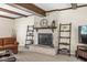 Comfortable living room with a white brick fireplace and floating shelves at 9221 Holyoke Ct, Indianapolis, IN 46268