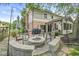 Inviting backyard patio with a stone fire pit and comfortable seating, ideal for outdoor entertaining and cozy evenings at 9221 Holyoke Ct, Indianapolis, IN 46268