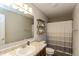Bathroom featuring a single sink vanity, large mirror, and a shower with a gray and white striped curtain at 929 Capricorn Dr, Franklin, IN 46131