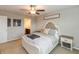 Bedroom featuring neutral walls and carpet, a ceiling fan, and a view of the bathroom through the doorway at 929 Capricorn Dr, Franklin, IN 46131