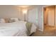 Bedroom featuring neutral walls and carpet, a lamp, and a bed with a white comforter at 929 Capricorn Dr, Franklin, IN 46131