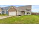 Single Gathering house with brick and vinyl exterior, two car garage, and green lawn at 929 Capricorn Dr, Franklin, IN 46131