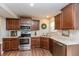 Beautiful kitchen features granite counters, stainless appliances, and custom wood cabinets at 929 Capricorn Dr, Franklin, IN 46131