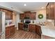 Stylish kitchen with granite countertops, stainless steel appliances, and rich wood cabinetry at 929 Capricorn Dr, Franklin, IN 46131