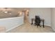 Loft area featuring neutral walls and carpet, a ceiling fan, and a workspace with desk and chair at 929 Capricorn Dr, Franklin, IN 46131