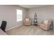 Office featuring neutral walls and carpet, a window overlooking the backyard, and two chairs at 929 Capricorn Dr, Franklin, IN 46131